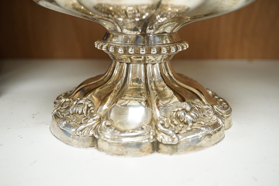 A pair of Old Sheffield plate two handled plated wine coolers, with later associated liners, 26cm high. Condition - fair